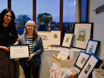 Fundraiser being presented with her Thank you certificate