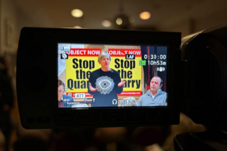 Back of camera screen showing image at a meeting