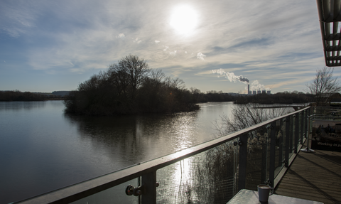 view of a pond from a balcony