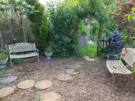 Benches and a quiet gravel area at the Oasis community centre.