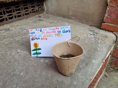 A handwritten message and compostable seed pot from William Booth School.