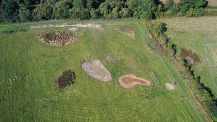 Landscape aerial view after pond construction