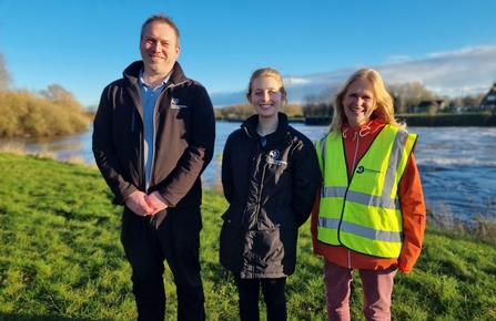 Three members of the project team stood in front of the River Trent