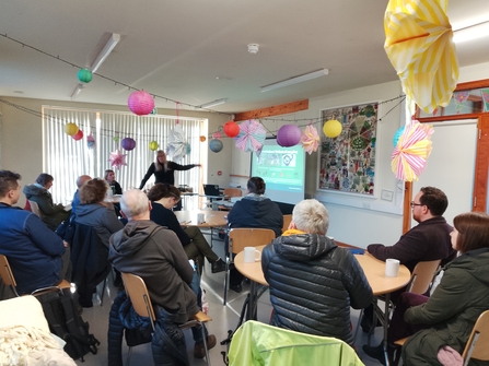 Speaker gives a workshop on species identification to a group of people