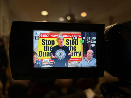 Back of camera screen showing image at a meeting