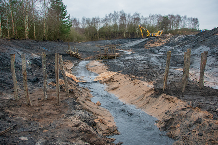 clay lined new river bed formed by diggers