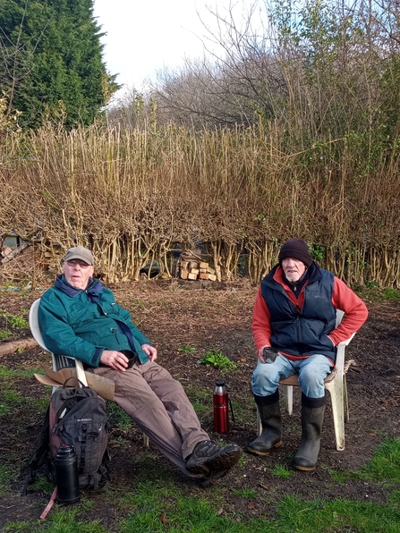 Two gentlemen having a cuppa tea on an allotment